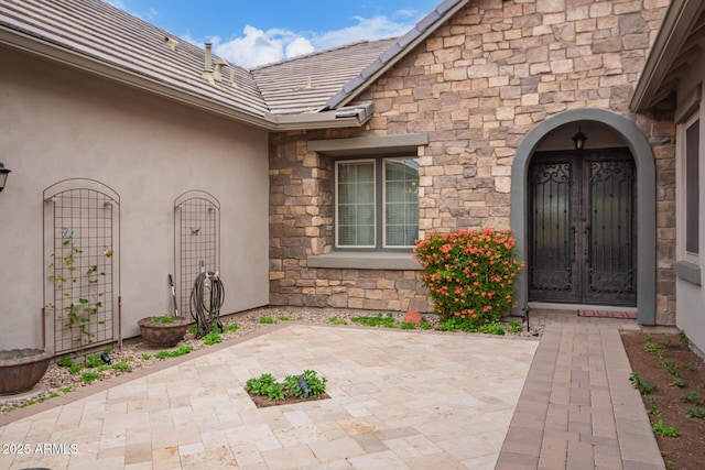 doorway to property with french doors and a patio