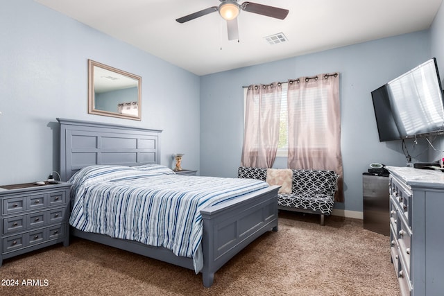 bedroom featuring ceiling fan and carpet