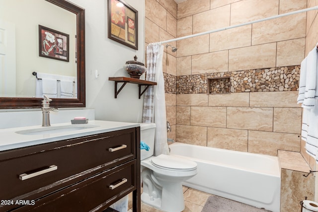 full bathroom featuring vanity, tile patterned flooring, shower / tub combo, and toilet