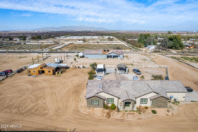 birds eye view of property featuring a mountain view