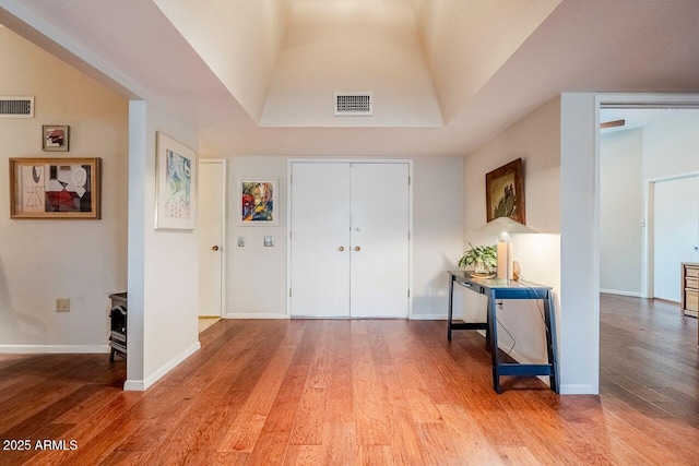 entryway with hardwood / wood-style flooring