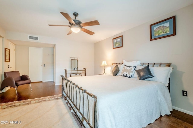 bedroom featuring ceiling fan and hardwood / wood-style floors