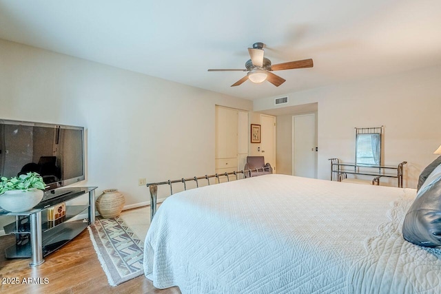 bedroom featuring ceiling fan and light hardwood / wood-style flooring