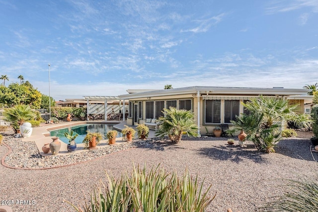 rear view of property featuring a patio