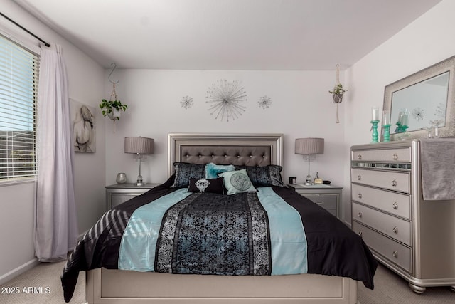 bedroom featuring light carpet