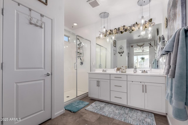 bathroom with vanity and an enclosed shower