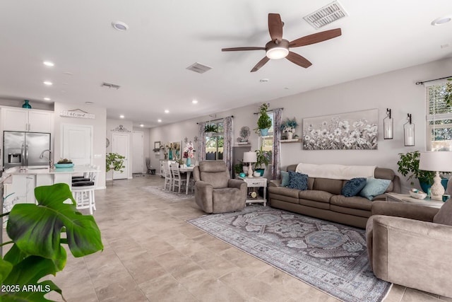 living room with ceiling fan