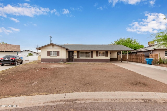 2022 E Mulberry Dr, Phoenix, AZ 85016 - ranch-style home featuring driveway, an attached carport, a shingled roof, and brick siding
