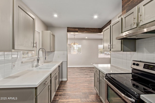 2022 E Mulberry Dr, Phoenix, AZ 85016 - kitchen with stainless steel electric range oven, gray cabinetry, a sink, dark wood-style floors, and under cabinet range hood