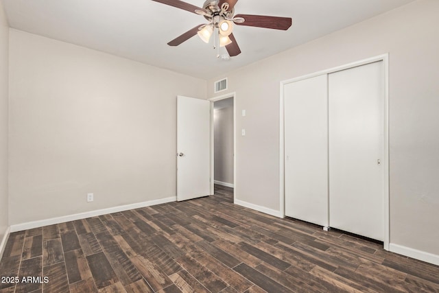 2022 E Mulberry Dr, Phoenix, AZ 85016 - unfurnished bedroom featuring dark wood-style floors, baseboards, ceiling fan, and a closet
