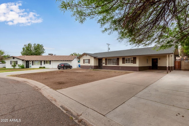 2022 E Mulberry Dr, Phoenix, AZ 85016 - single story home featuring driveway, brick siding, and an attached carport
