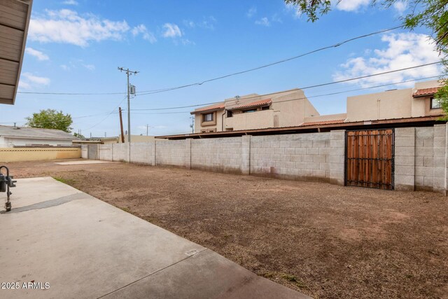 2022 E Mulberry Dr, Phoenix, AZ 85016 - fenced backyard with a patio area and a gate