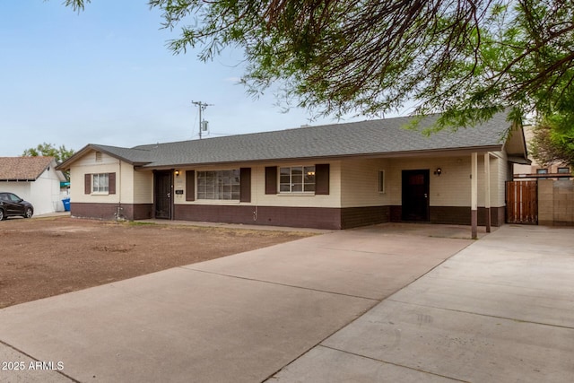 2022 E Mulberry Dr, Phoenix, AZ 85016 - single story home with driveway, an attached carport, brick siding, and roof with shingles