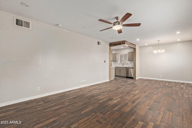 2022 E Mulberry Dr, Phoenix, AZ 85016 - unfurnished living room with a chandelier, a ceiling fan, dark wood-style flooring, recessed lighting, and baseboards