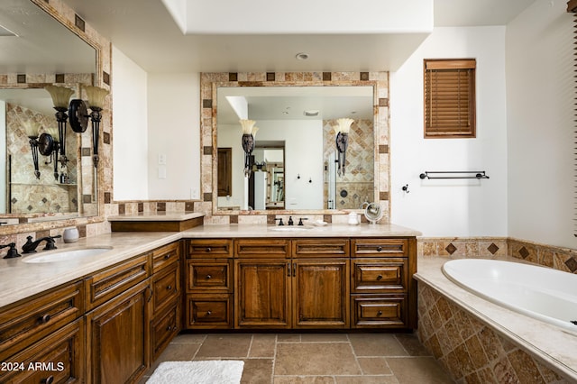 bathroom with a relaxing tiled tub and vanity