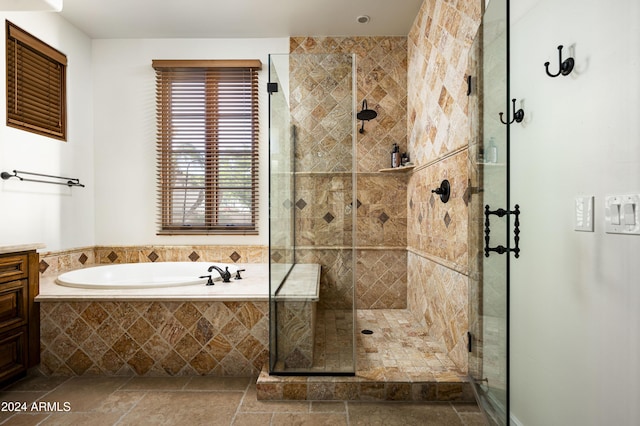 bathroom with shower with separate bathtub