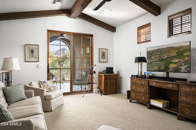 living room with lofted ceiling with beams and carpet floors