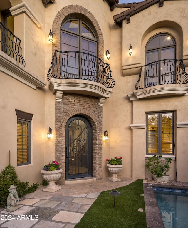 doorway to property with a balcony