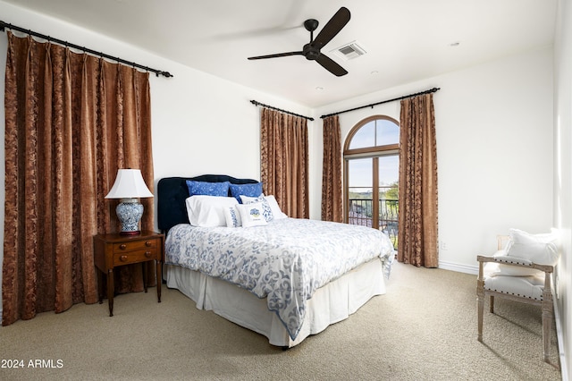 carpeted bedroom featuring access to exterior and ceiling fan