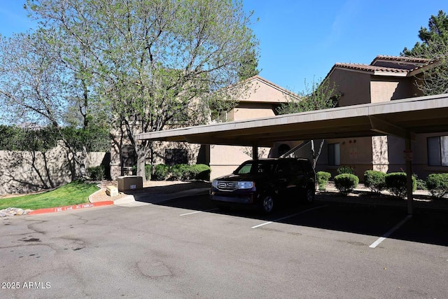 view of partially covered parking lot