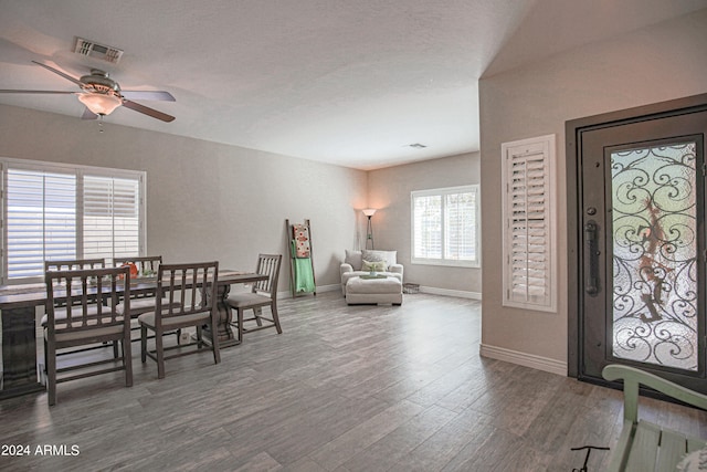 dining room with wood-type flooring and ceiling fan