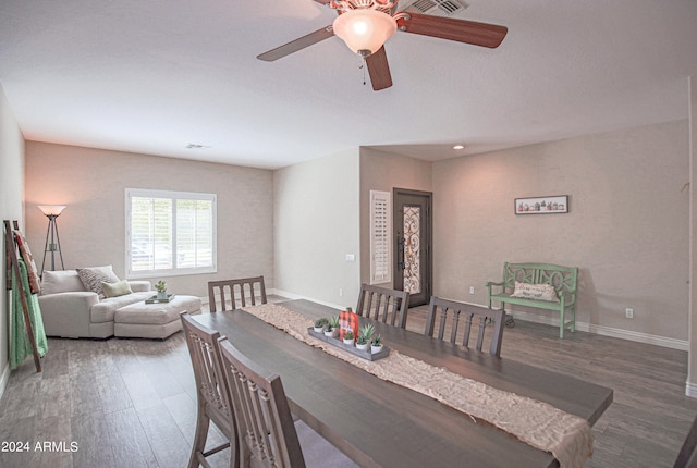 dining room featuring dark hardwood / wood-style flooring and ceiling fan