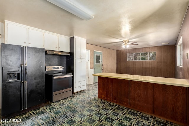 kitchen with stainless steel electric range oven, black refrigerator with ice dispenser, a ceiling fan, under cabinet range hood, and dark floors