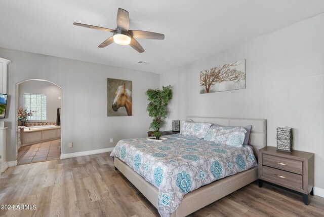 bedroom with light hardwood / wood-style flooring and ceiling fan