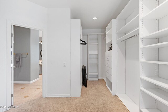 bathroom featuring independent shower and bath and tile patterned flooring