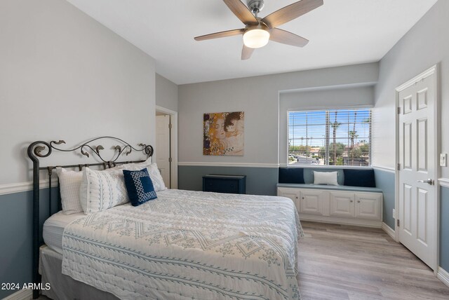 bedroom featuring ceiling fan and light hardwood / wood-style flooring