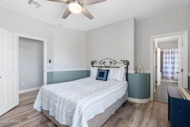 bedroom with ceiling fan and light hardwood / wood-style floors