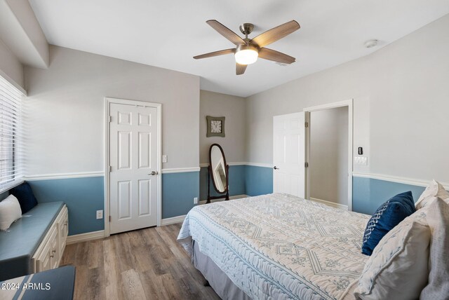 full bathroom with toilet, shower / tub combo with curtain, an inviting chandelier, tile patterned floors, and vanity