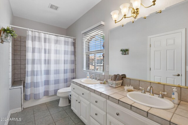 bedroom with light hardwood / wood-style flooring, connected bathroom, and ceiling fan