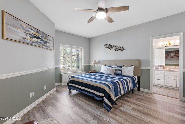 laundry room featuring washer and dryer, sink, cabinets, and light tile patterned flooring