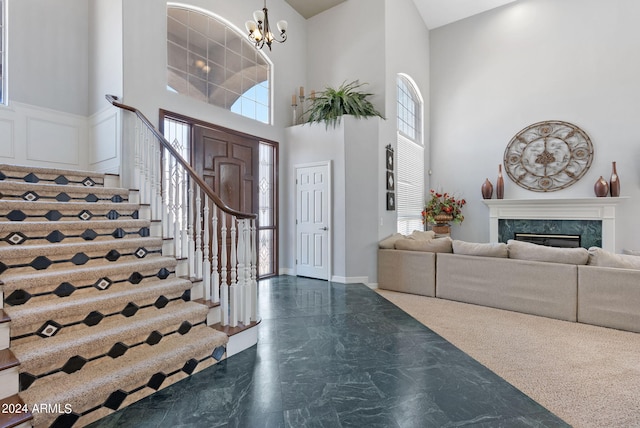 entryway featuring a high ceiling and a chandelier