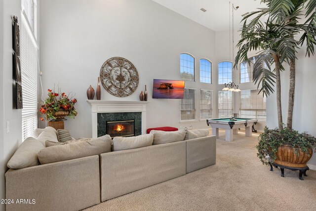 recreation room featuring a high ceiling, light carpet, and pool table