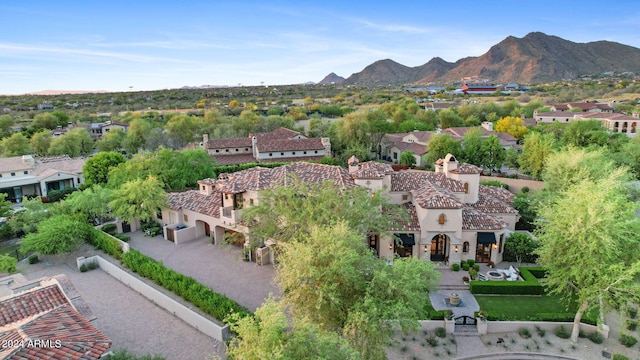 birds eye view of property featuring a mountain view