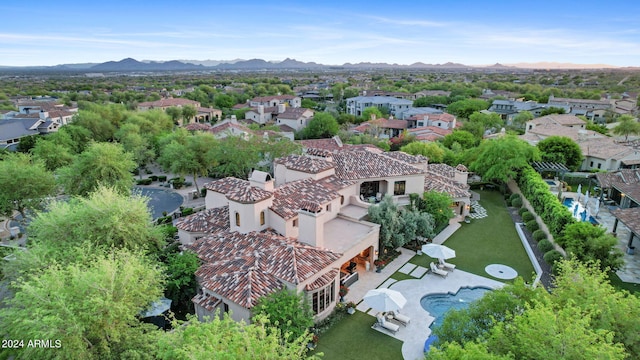 birds eye view of property with a mountain view