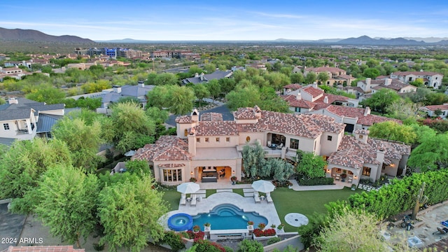 birds eye view of property featuring a mountain view