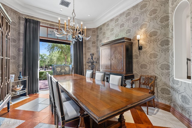 dining area with a chandelier, a wealth of natural light, light tile flooring, and crown molding