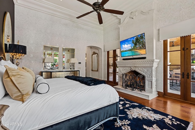 bedroom with access to exterior, ceiling fan, hardwood / wood-style flooring, ornamental molding, and french doors