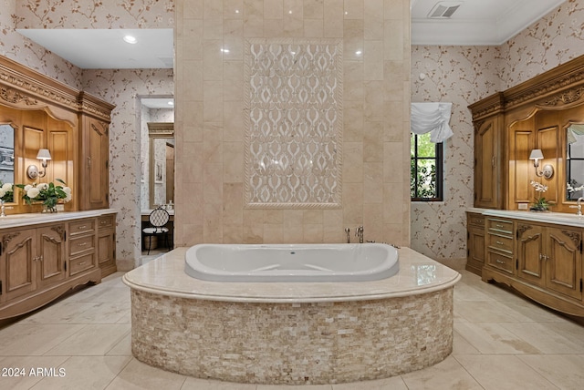 bathroom featuring tile floors, a relaxing tiled bath, ornamental molding, and vanity