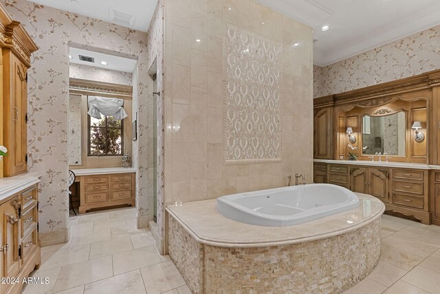 bathroom featuring tiled bath, tile flooring, vanity, and crown molding