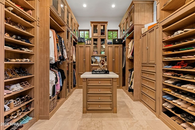 spacious closet with light tile floors