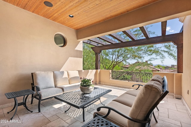 view of terrace with outdoor lounge area and a pergola