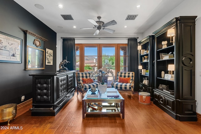 interior space featuring wood-type flooring and ceiling fan