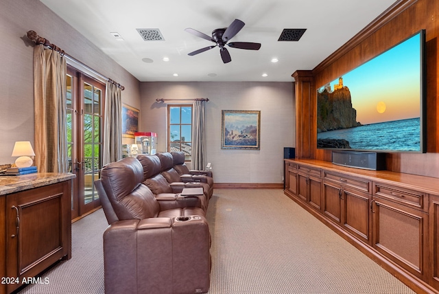 carpeted living room with ceiling fan