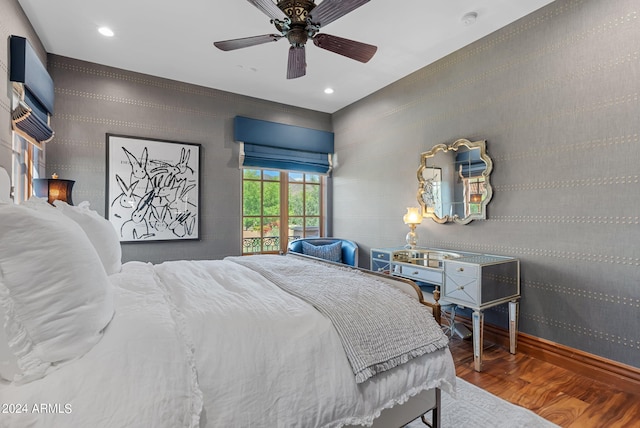 bedroom with ceiling fan and wood-type flooring