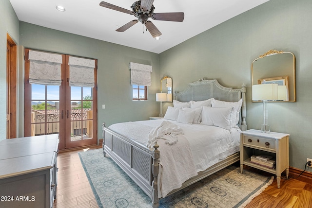 bedroom featuring french doors, wood-type flooring, ceiling fan, and access to exterior