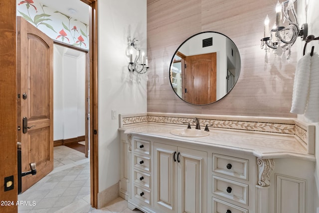 bathroom featuring vanity with extensive cabinet space and tile floors